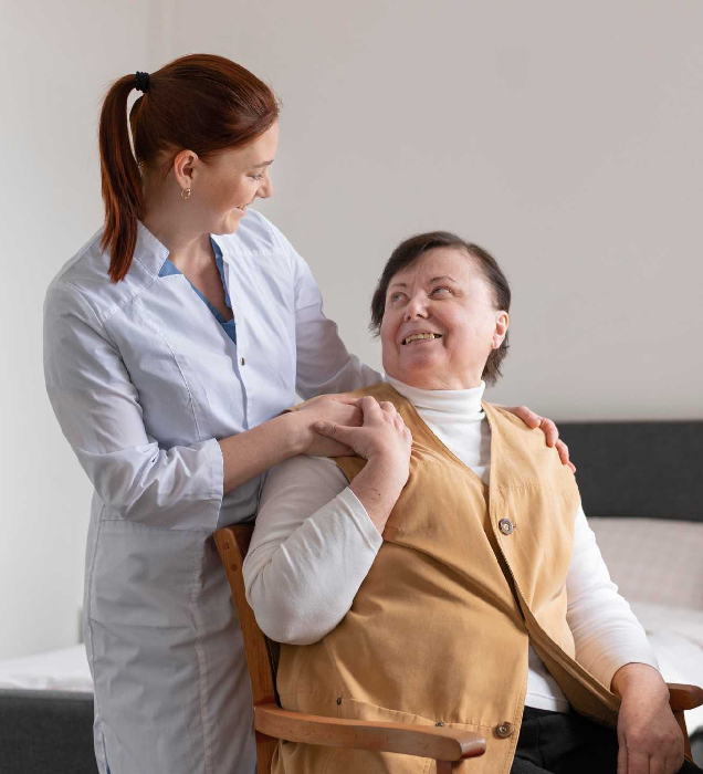Image of a support worker assisting a client with tenancy paperwork
