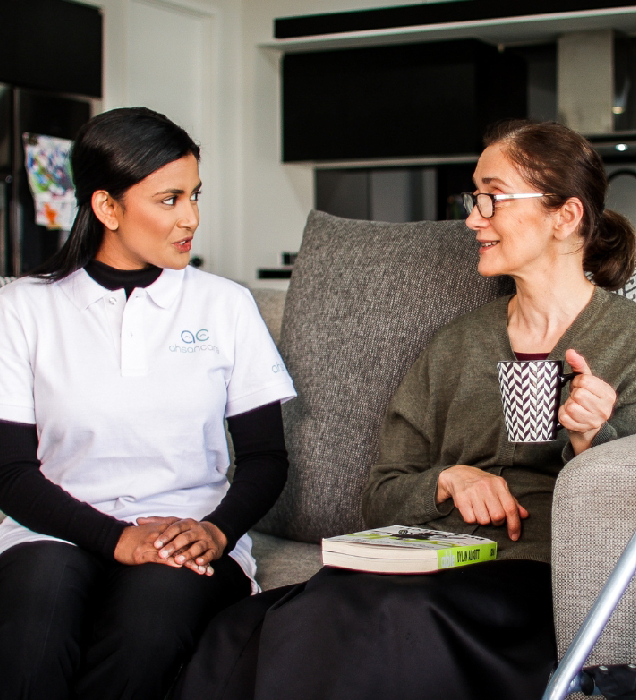 Image of a support worker assisting a client with tenancy paperwork