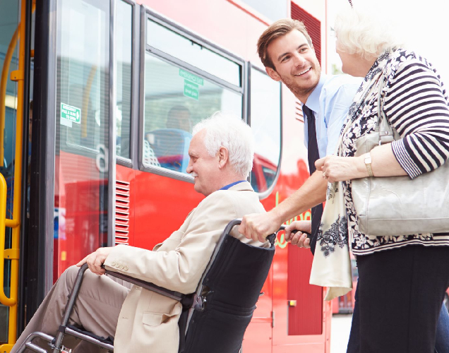 Image of a support worker and client inside a comfortable transport vehicle